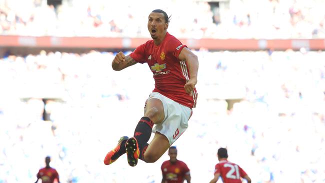 TOPSHOT - Manchester United's Swedish striker Zlatan Ibrahimovic celebrates scoring their second goal during the FA Community Shield football match between Manchester United and Leicester City at Wembley Stadium in London on August 7, 2016. / AFP PHOTO / GLYN KIRK / NOT FOR MARKETING OR ADVERTISING USE / RESTRICTED TO EDITORIAL USE