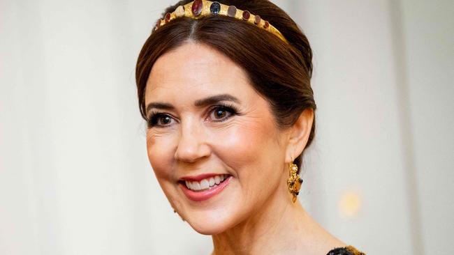 Queen Mary of Denmark smiles during a gala dinner at the Presidential Palace in Helsinki, Finland, on March 4, 2025 during a 2-day state visit of the Danish royal couple to Finland. (Photo by Ida Marie Odgaard / Ritzau Scanpix / AFP) / Denmark OUT