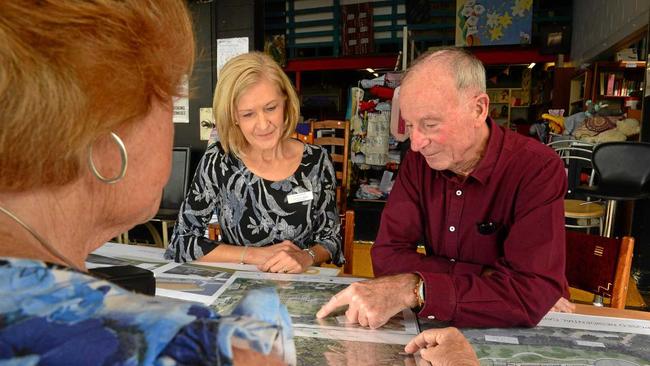 PLANS REVEALED: Sue Mason-Baker and Frank Lewins of the Sunshine Coast Hospice Charity check out the plans for the new premises in Buderim. Picture: John McCutcheon