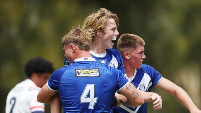 Zane Shutes (left) and Jesse Stevens (centre) celebrate a try in the Bulldogs’ win. Picture: Sue Graham