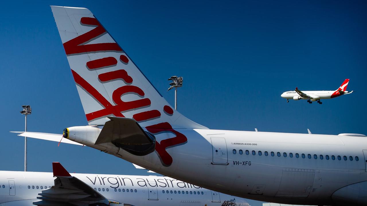 Virgin Australia aircraft parked on the tarmac at Brisbane Airport. Picture: Patrick Hamilton/AFP