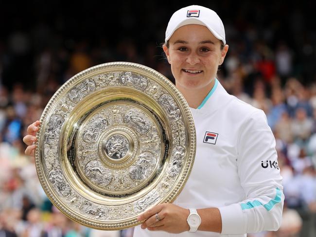 MARCH 23, 2022: World number 1 and three-time Grand Slam winner Ash Barty has announced her retirement from tennis at the age of 25. LONDON, ENGLAND - JULY 10: Ashleigh Barty of Australia celebrates with the Venus Rosewater Dish trophy after winning her Ladies' Singles Final match against Karolina Pliskova of The Czech Republic  on Day Twelve of The Championships - Wimbledon 2021 at All England Lawn Tennis and Croquet Club on July 10, 2021 in London, England. (Photo by Clive Brunskill/Getty Images)