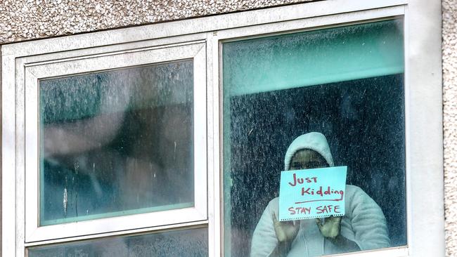 A resident of a North Melbourne public housing tower gets a message out. Picture: Tim Carrafa