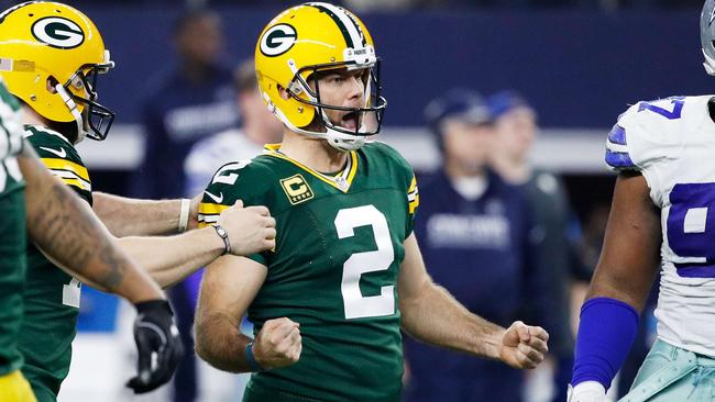 Mason Crosby #2 of the Green Bay Packers reacts after kicking a field goal to win the game.