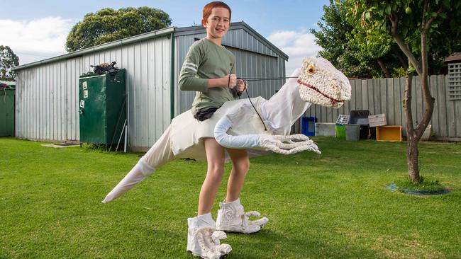 Mitchell builds his own puppet dinosaur. Picture: Jason Edwards