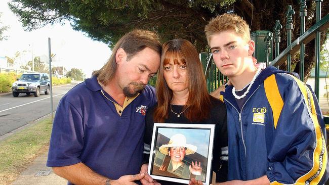 Duane and Helen Shaw with their son Daniel and a photo of daughter Leisa who was killed in June 2004.