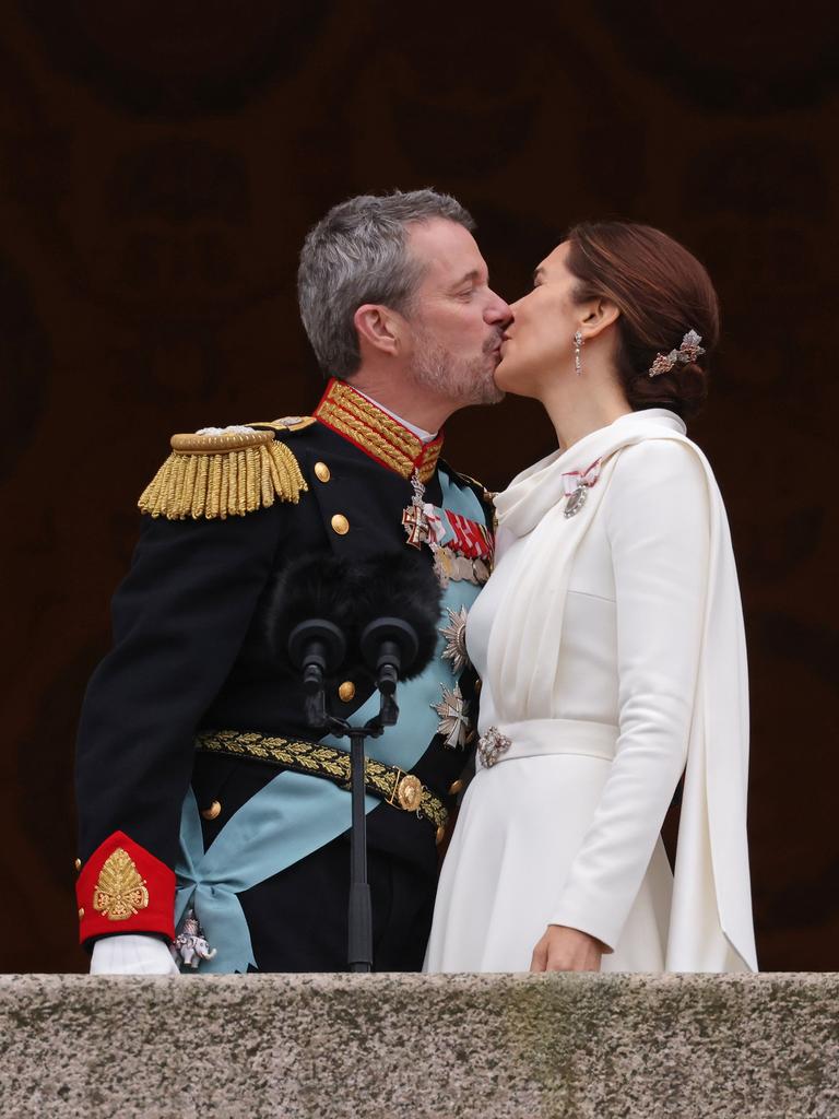 King Frederik X and Queen Mary kiss on the balcony of Christiansborg Palace shortly after his proclamation. Picture: Getty Images