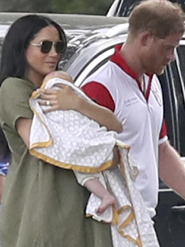 Britain's Prince Harry and Meghan, Duchess of Sussex walk with their son Archie. Picture: AP