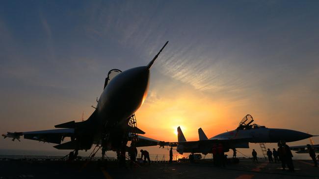 J15 fighter jets on China's operational aircraft carrier, the Liaoning, during a drill at sea. Picture: AFP
