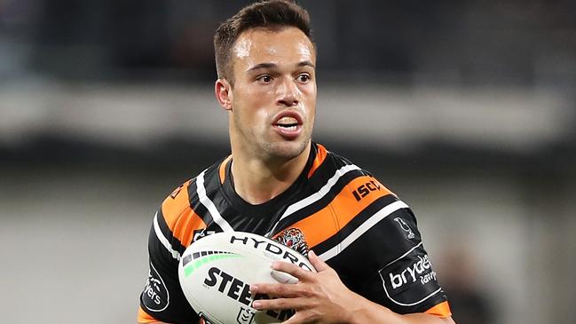 SYDNEY, AUSTRALIA - JUNE 28: Luke Brooks of the Wests Tigers runs the ball during the round seven NRL match between the Canterbury Bulldogs and the Wests Tigers at Bankwest Stadium on June 28, 2020 in Sydney, Australia. (Photo by Mark Kolbe/Getty Images)