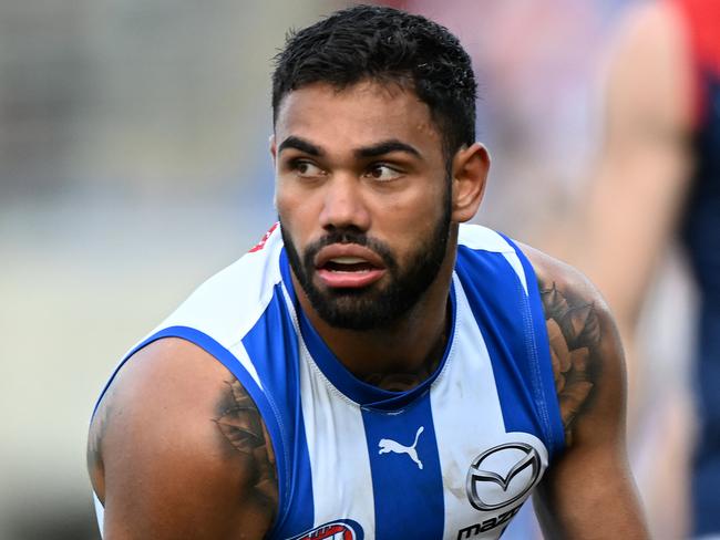 HOBART, AUSTRALIA - AUGUST 06: Tarryn Thomas of the Kangaroos runs the ball during the round 21 AFL match between North Melbourne Kangaroos and Melbourne Demons at Blundstone Arena, on August 06, 2023, in Hobart, Australia. (Photo by Steve Bell/Getty Images)