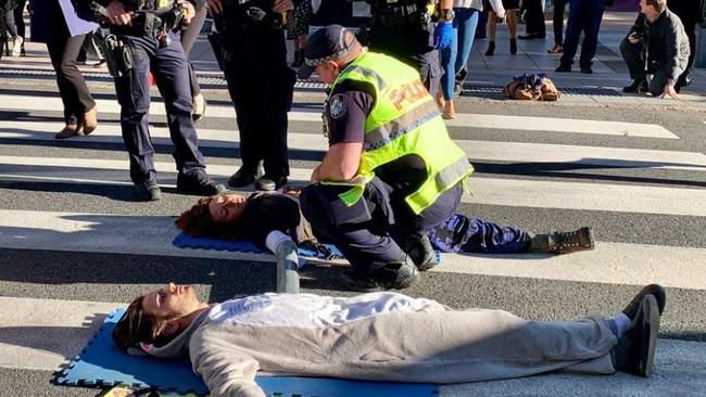 Climate change protesters in Brisbane during peak hour.