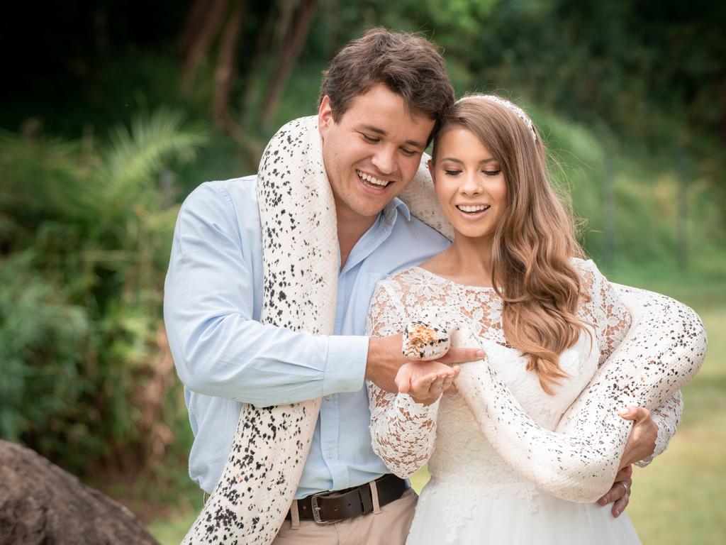 Chandler Powell and Bindi Irwin on their wedding day with a python. Picture: Kate Berry