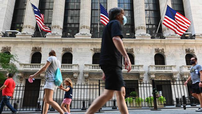 People walk past the New York Stock Exchange, which marked a stunning rebound by the S&amp;P 500. Picture: AFP