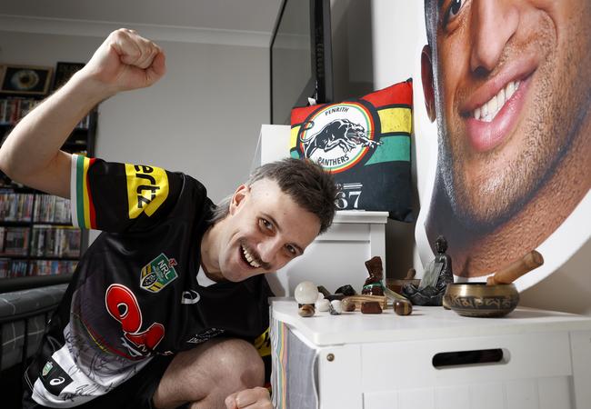 Tim Moodie at home with his Viliame Kikau shrine which he believes helped him to win. Picture: Jonathan Ng