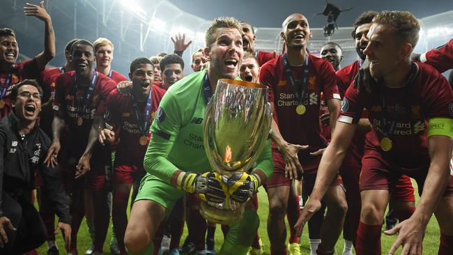 Adrian lifts the UEFA Super Cup trophy as Liverpool celebrates victory over Chelsea.