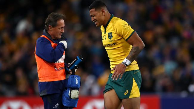 Israel Folau leaves the field injured during the loss to the All Blacks. Picture: Getty Images