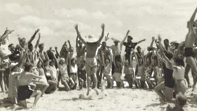 Gold Coast 'Schoolies' in the 1950s. Revelers perform the 'Hokey Pokey' on Greenmount Beach.