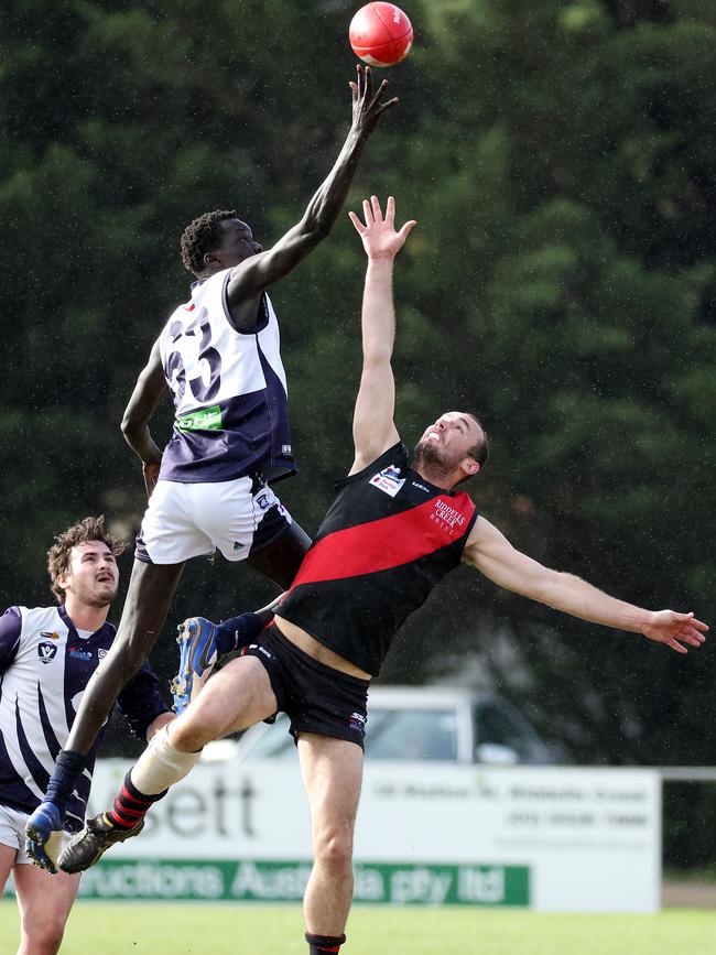 RDFL: Akoi Akoi of Melton Centrals wins the tap over Riddell’s Josh Grabham. Picture: George Sal