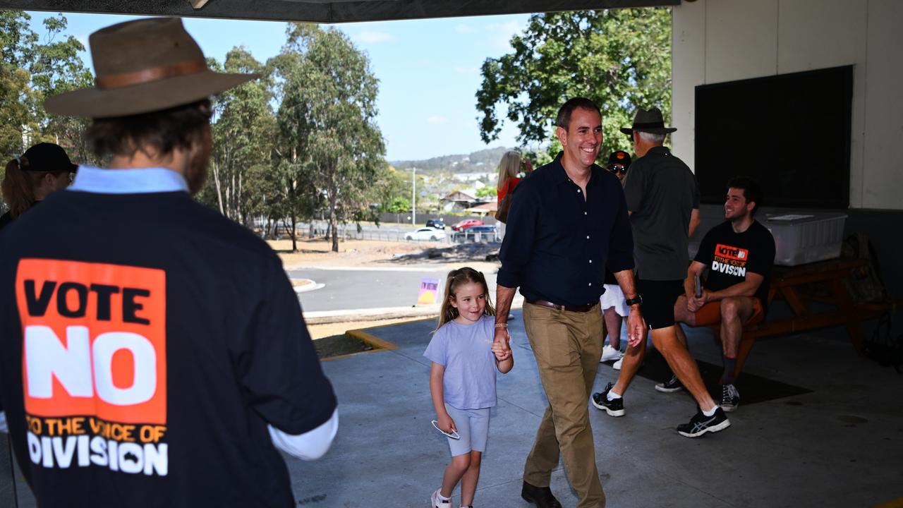 Federal Treasurer Jim Chalmers and his daughter Annabel arrive to vote in the Voice referendum at Springwood Central State School.