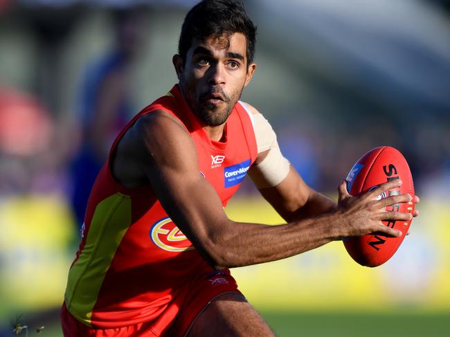 Jack Martin of the Suns runs with the ball during the Round 7 AFL match between the Western Bulldogs and the Gold Coast Suns at Mars Stadium in Ballarat, Victoria, Saturday, May 5, 2018. (AAP Image/Joe Castro) NO ARCHIVING, EDITORIAL USE ONLY