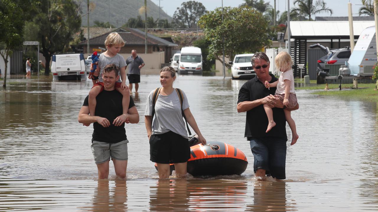 The Richardson family head for higher ground. Dan Richardson with Noah 5, Kristie Richardson, and Gary Clarke with Chloe Richardson, 2. Picture Glenn Hampson