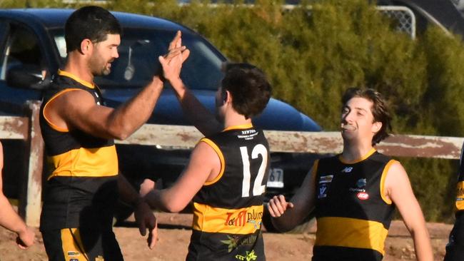 Rushworth celebrates a goal against the reigning premiers. Picture: Angela McKinley.