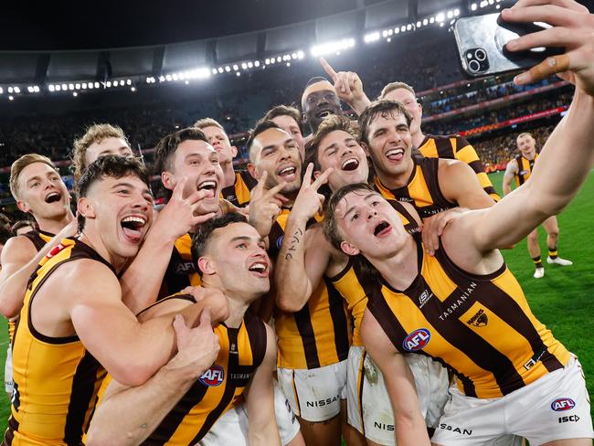 MELBOURNE, AUSTRALIA - SEPTEMBER 06: Calsher Dear of the Hawks takes a selfie with teammates during the 2024 AFL Second Elimination Final match between the Western Bulldogs and the Hawthorn Hawks at The Melbourne Cricket Ground on September 06, 2024 in Melbourne, Australia. (Photo by Dylan Burns/AFL Photos via Getty Images)