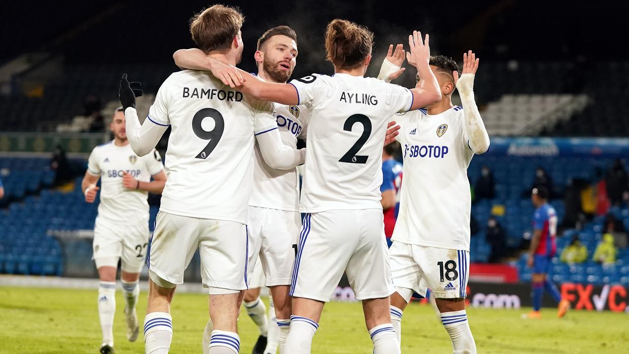 LEEDS, ENGLAND - FEBRUARY 08: Patrick Bamford of Leeds United celebrates with (L-R) Stuart Dallas, Luke Ayling, Raphinha after scoring their team's second goal during the Premier League match between Leeds United and Crystal Palace at Elland Road on February 08, 2021 in Leeds, England. Sporting stadiums around the UK remain under strict restrictions due to the Coronavirus Pandemic as Government social distancing laws prohibit fans inside venues resulting in games being played behind closed doors. (Photo by Jon Super - Pool/Getty Images)