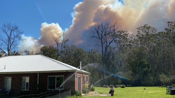 Smoke from an out-of-control bushfire fills the sky north of Briagolong.