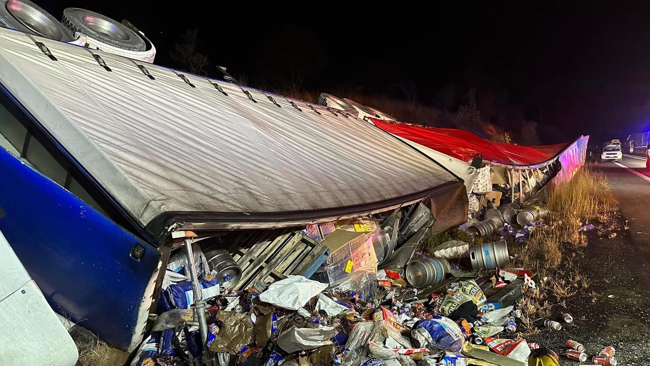 Kegs and cases of beer were strewn along the highway following the truck rollover on the Bruce Highway on Wednesday morning.