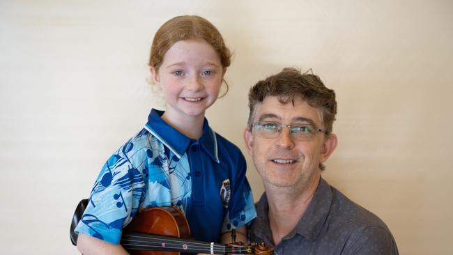 Mya Bray won first place for her string solo (8 years and under) at the Gympie Eisteddfod. Pictured with her dad, Jason Bray. August 1, 2023. Picture: Christine Schindler