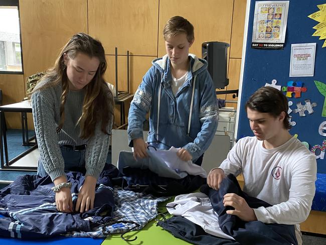 Jasmine Sharp, Jay Bush and Melanie Steed senior school leader sorting through donated school uniforms. Picture: Supplied