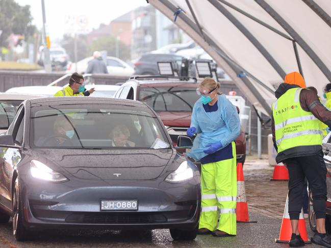 People wait to be tested at the Bondi beach COVID-19 drive through testing centre. Picture: NCA NewsWire / Damian Shaw