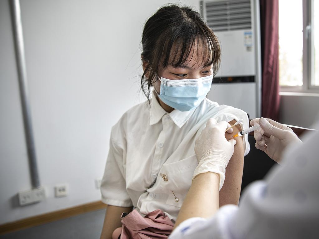 A women wears receives a dose of a covid vaccine in Wuhan, Hubei Province, on June 9. Picture: Getty Images