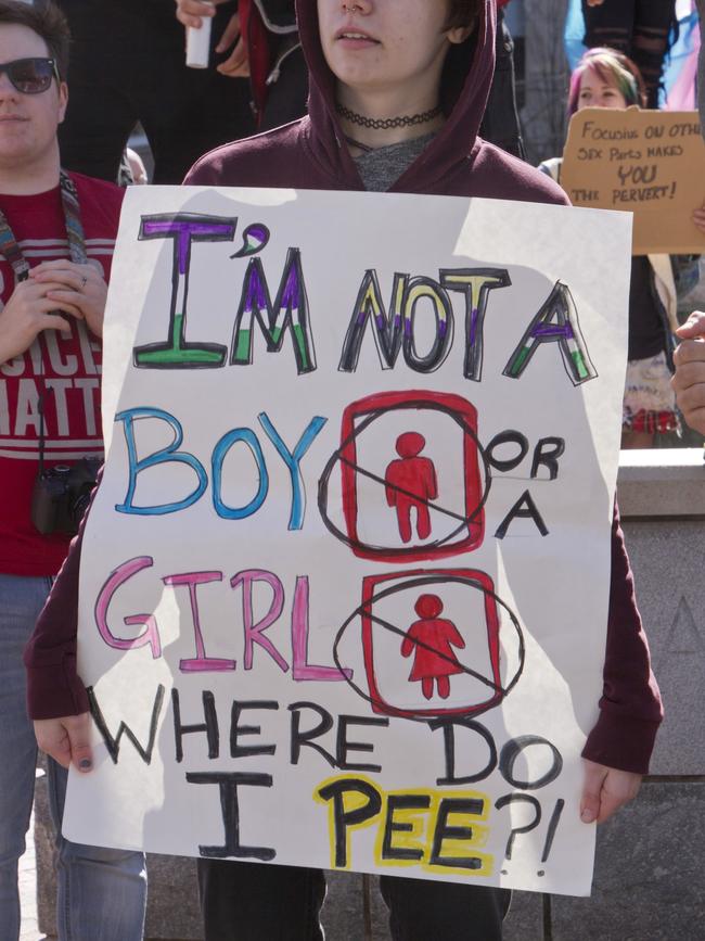 A protester rallies about the North Carolina law which denies rights to those who are gay or transgender earlier this year.