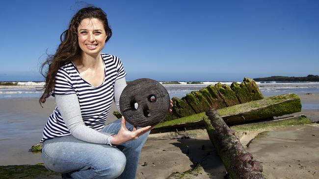 A group of volunteers from Amazon 1863 Project have received a grant to conserve shipwreck artefacts. Volunteer Trilby Parise at the shipwreck holding a dead eye a part of the ships rigging system. Picture: Sarah Matray