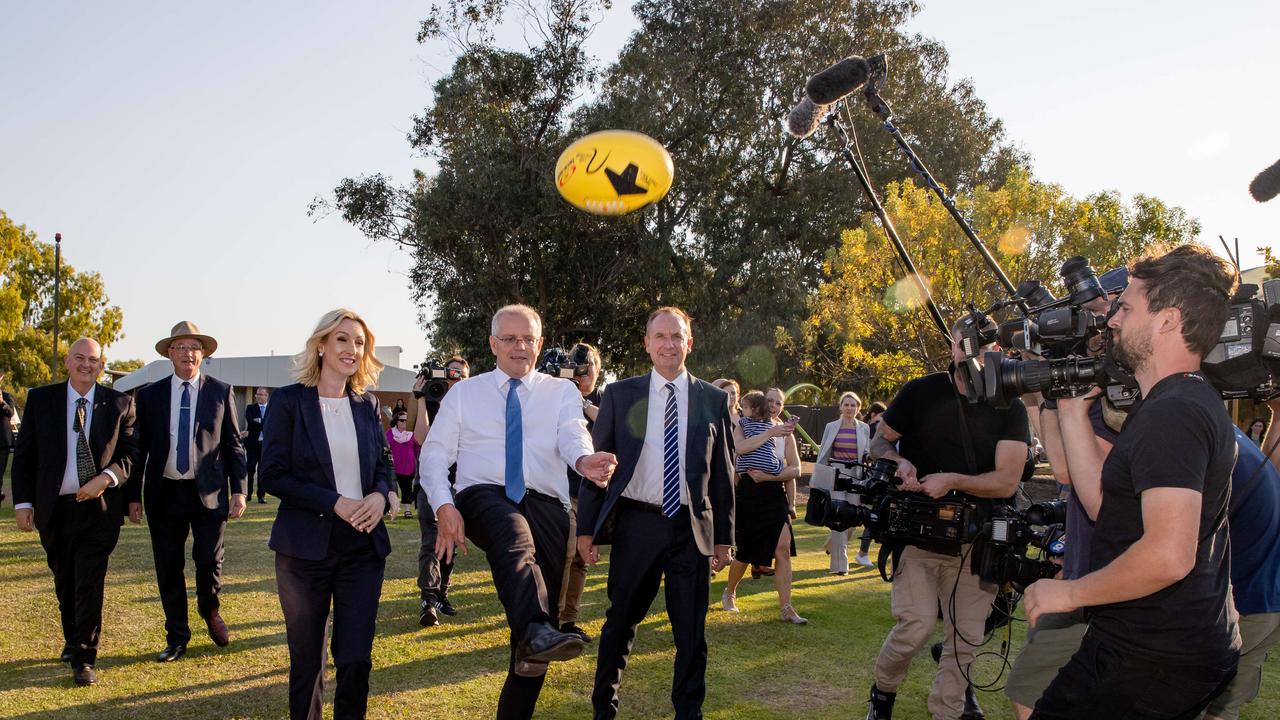 Australia’s leader kicks a football during the week the nation’s inflation rose to 5.1 per cent. Picture: Jason Edwards