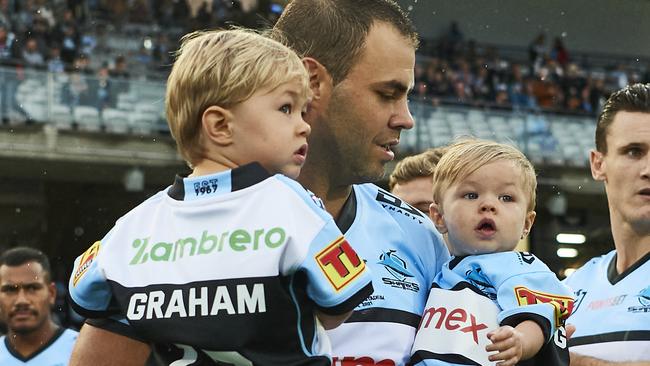 Wade Graham takes to the field with his children to celebrate his 250th game (Photo by Brett Hemmings/Getty Images)