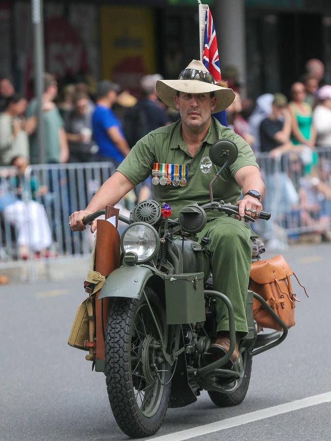 Jayson Jackson on a WW2 era dispatch bike in Brisbane for the 2023 ANZAC Day March. Picture: NCA NewsWire / Glenn Campbell