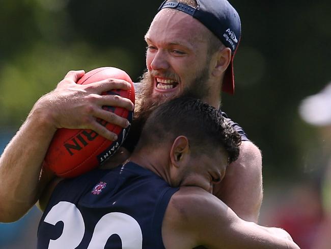 Max Gawn is wrapped up by Neville Jetta. Picture: Wayne Ludbey