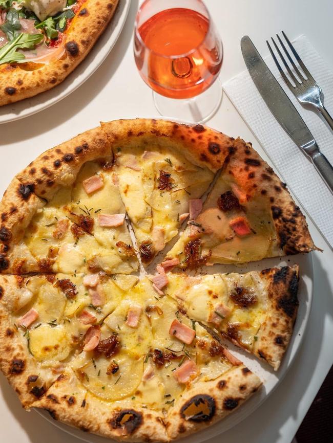 Smolt Kitchen's potato pizza with rosemary, taleggio, smoked bacon and caramelised onion is another from the popular West Hobart eatery’s extensive pizza menu. Picture: Supplied