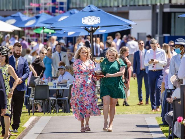 Frontline workers paediatric nurse Angela Maxwell and aged care nurse Lisa Travis bring the cup home to Flemington. Picture: Jason Edwards