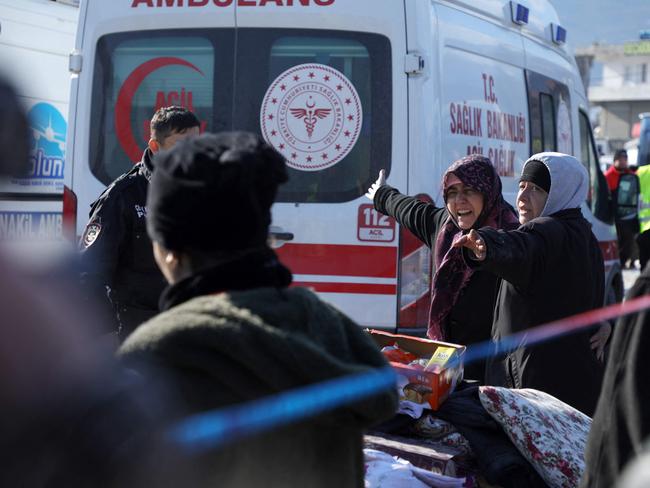 Women weep near an ambulance after the body of their relative was retrieved in the rubble of destroyed buildings in Nurdagi, in the hard hit region of Gaziantep. Picture: AFP