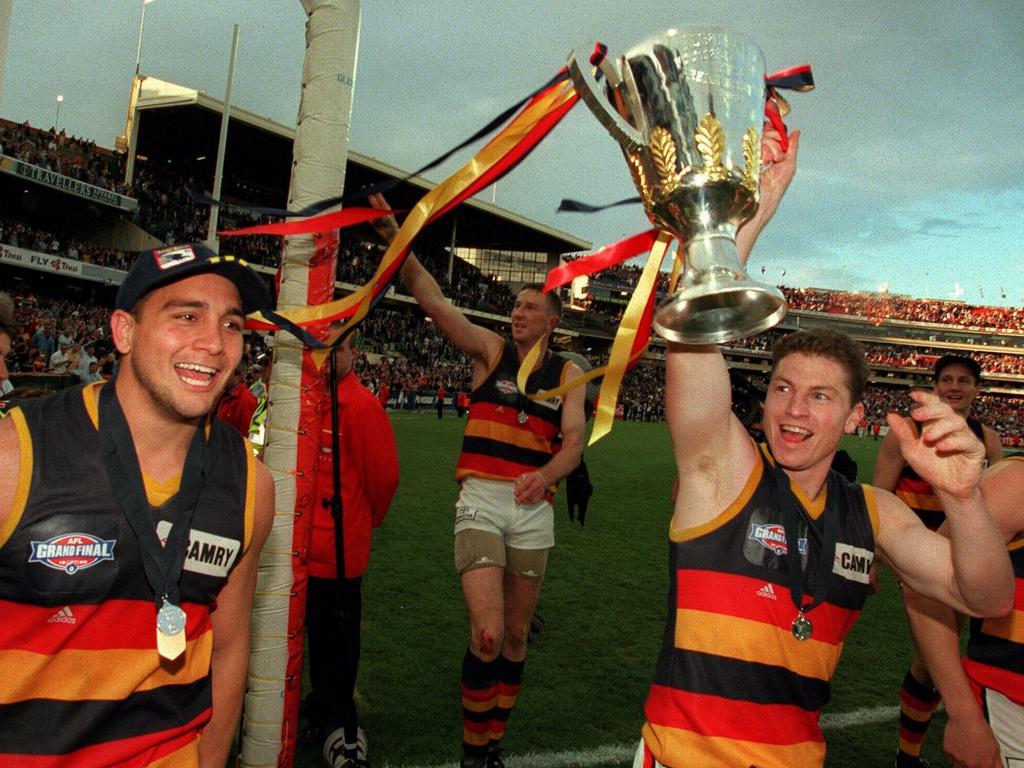 Mark Bickley, right, and Andrew McLeod after the Crows went back-to-back in 1998.