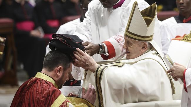 Newly appointed Cardinal Mykola Bychok, receives the biretta hat by Pope Francis during a consistory for the creation of new Cardinals at The Vatican on December 7. Picture: Getty