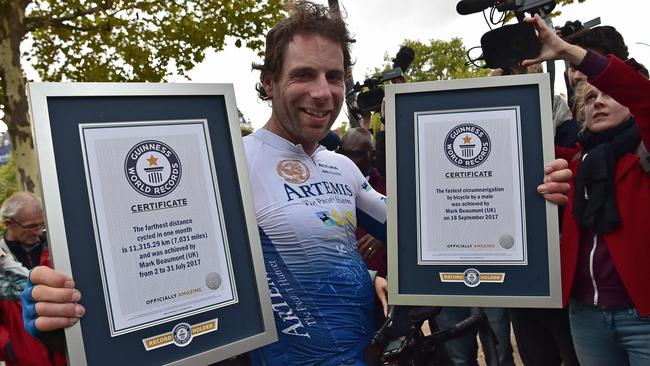 It's a record ... with his Guinness World Records certificates. Picture: AFP/Christophe Archambault