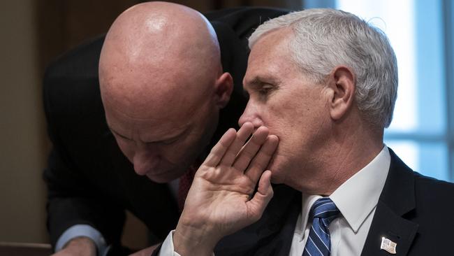 Vice-president Mike Pence, pictured with his chief of staff Mark Short, has been put in a tricky position. Picture: Getty Images