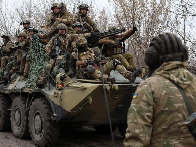 Ukrainian servicemen get ready to repel an attack in Ukraine's Lugansk region. Picture: AFP