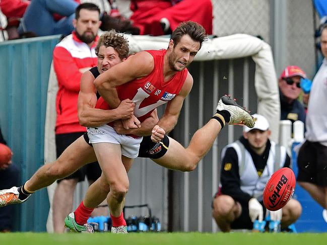 11/06/18 - SANFL match between Glenelg and North Adelaide at Glenelg Oval.  Glenelg's Matt Snook tackles North's Jarred Allmond. Picture: Tom Huntley